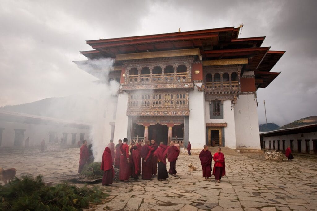 monks burning cypress leaves as incense in front of gangtey monastery 1260x840