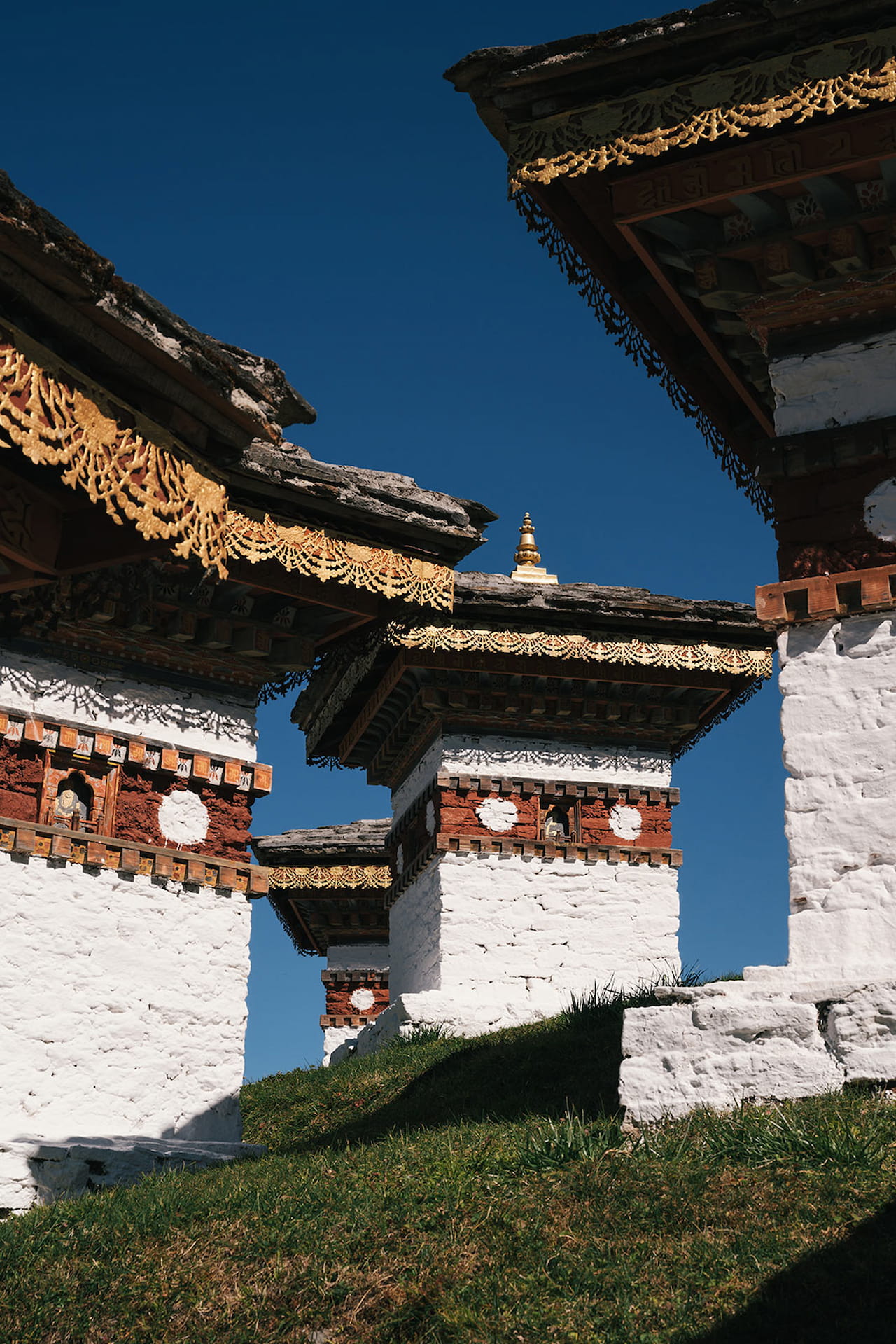 108 memorial chortens at Dochula Pass in Bhutan with snow-capped Himalayan peaks in the background
