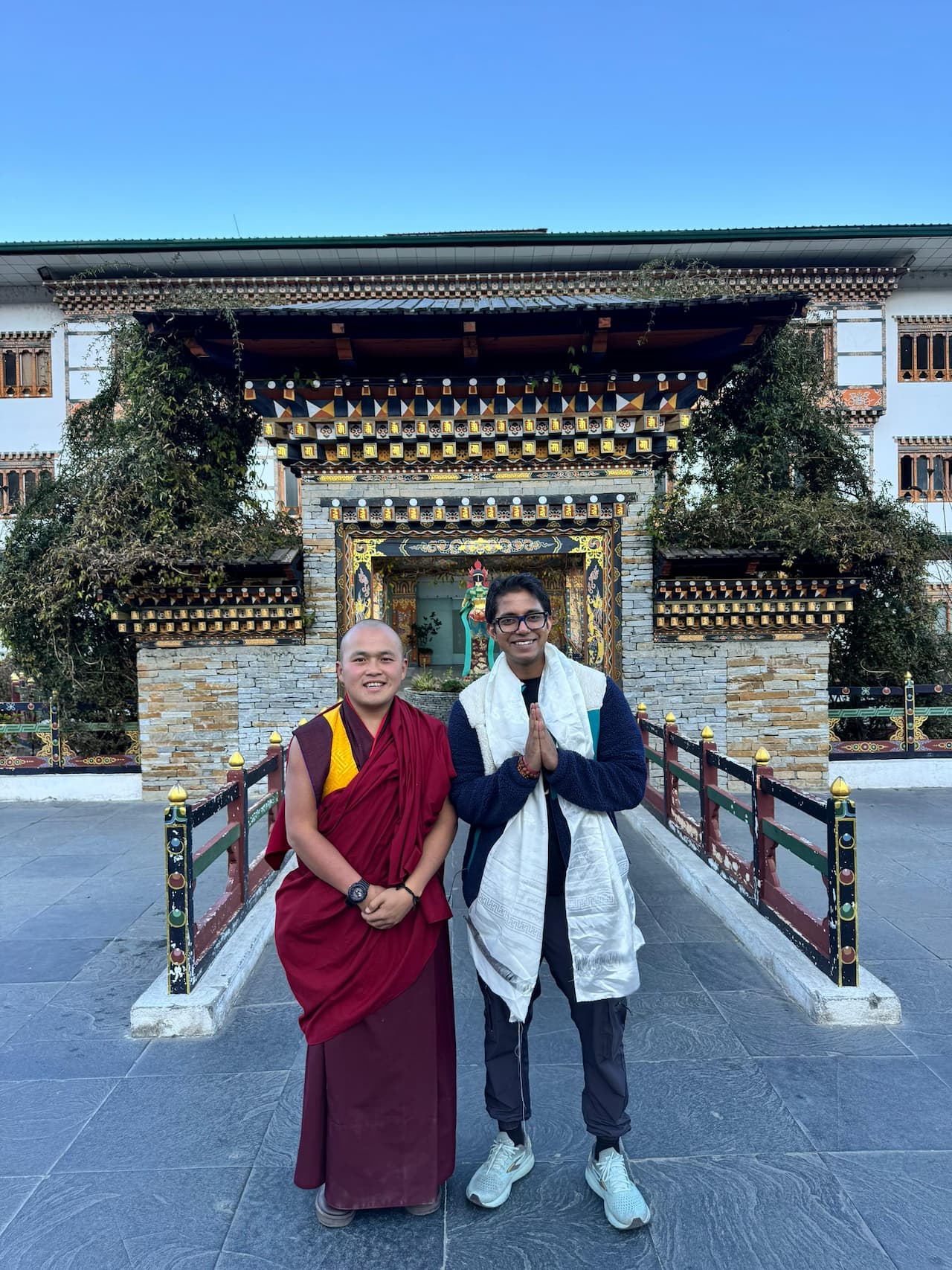 Guest with a Bhutanese monk, facilitated through Saidpiece Travels' local connections