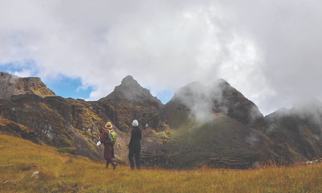 Trekkers on a misty Himalayan ridgeline