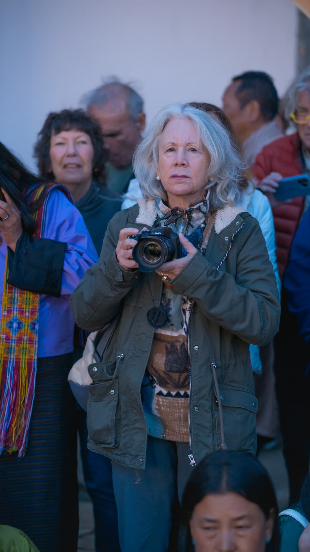 A traveller photographing a Bhutanese festival