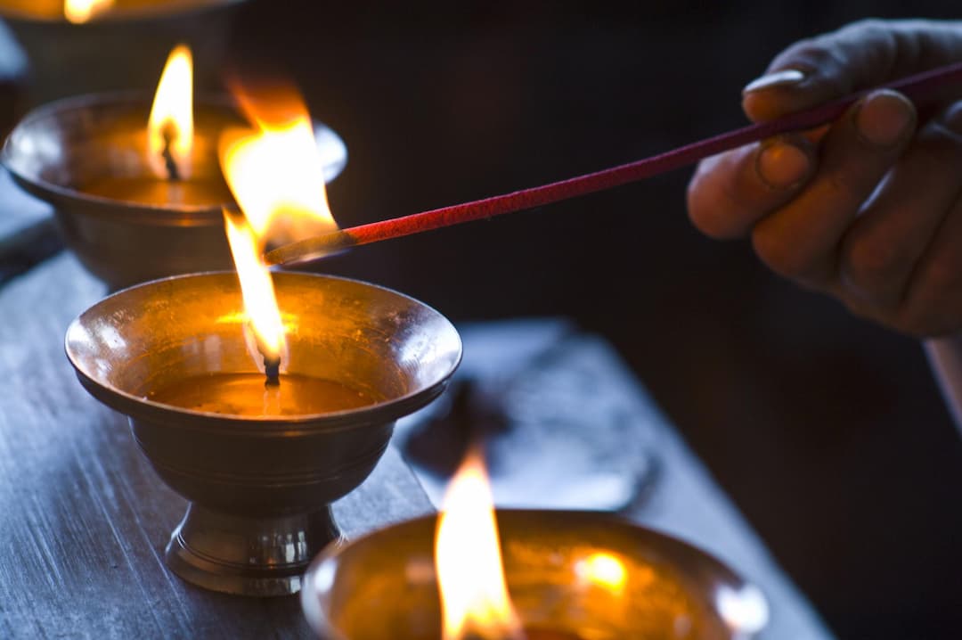 Butter lamps lit as offerings