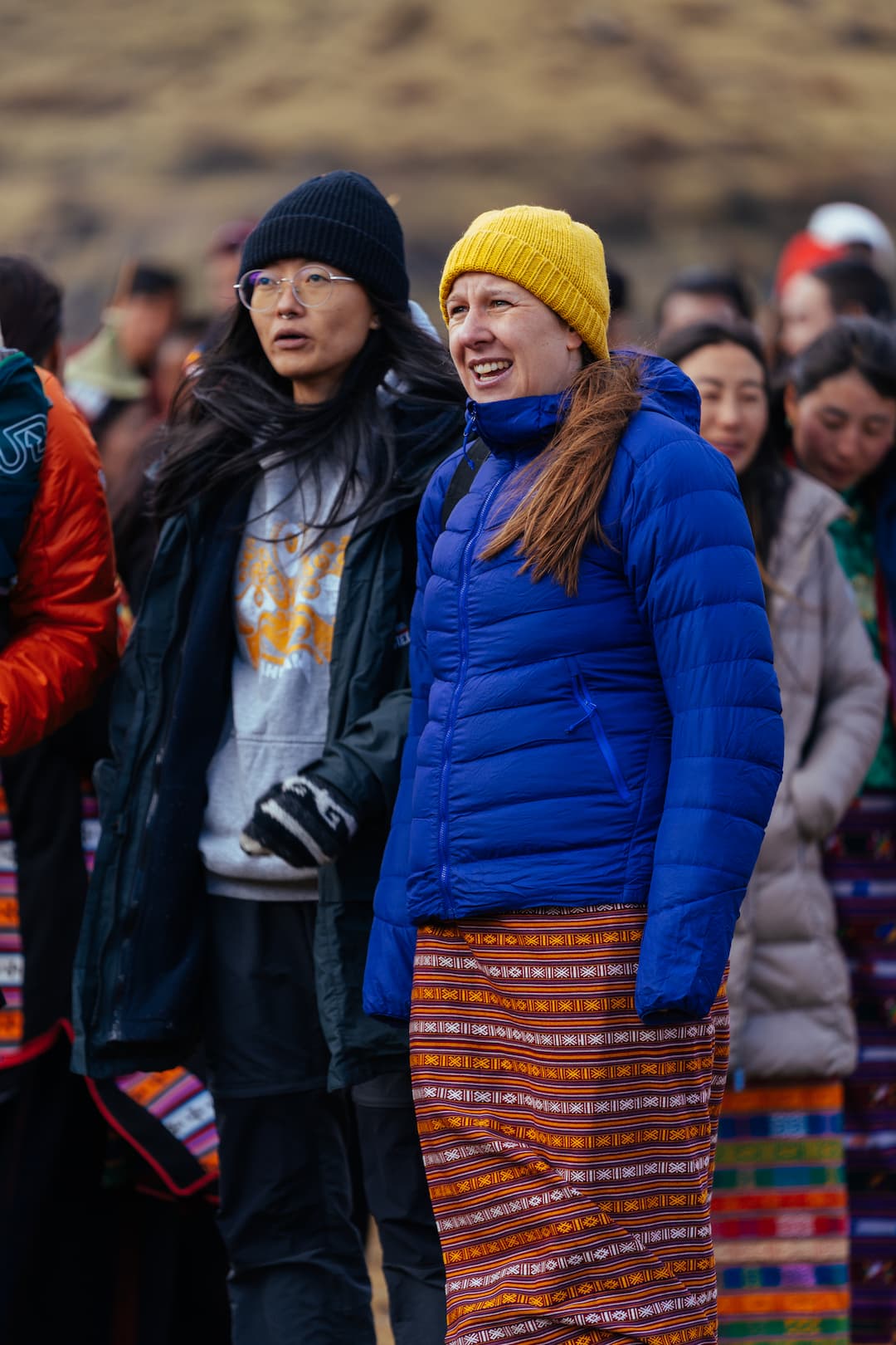 A traveller wearing a traditional Bhutanese kira at a festival