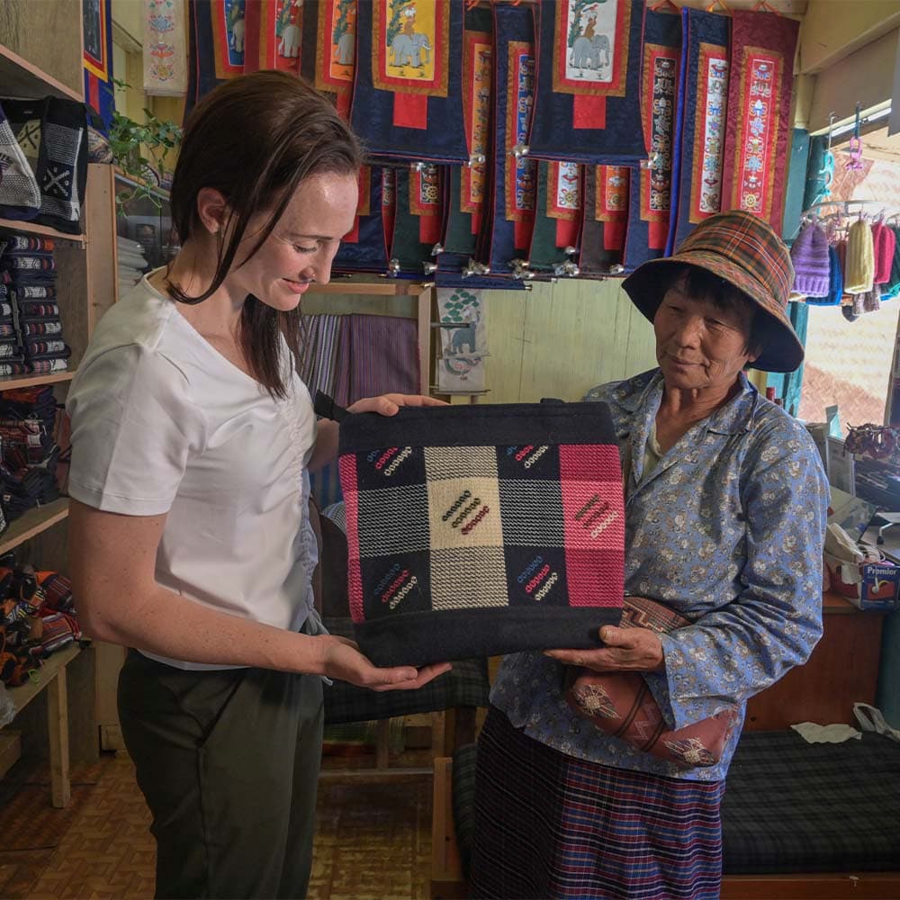 A traveller with a Bhutanese weaver and handwoven textiles