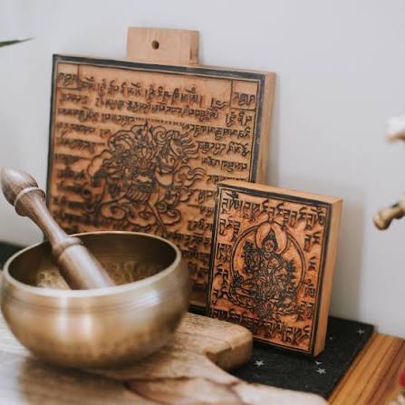 Prayer flag printing with carved wooden blocks in Bhutan