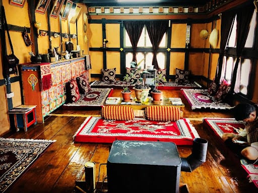 Rural farm stay in Bhutan, traditional farmhouse and fields